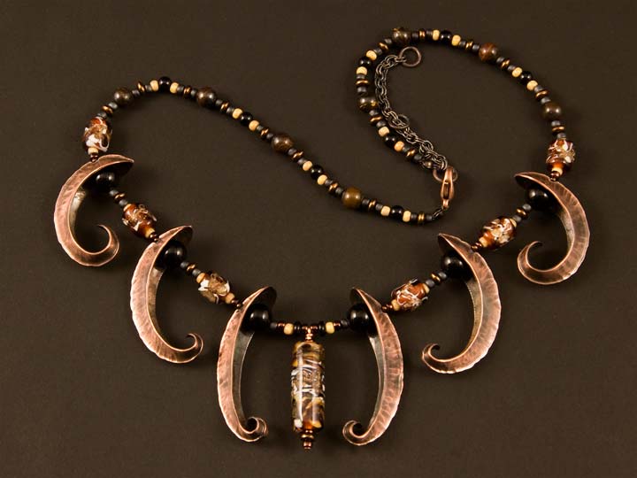 Necklace made with forged copper pieces and lampworked glass beads