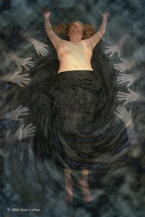 A woman lies floating in swirling mist, a black full-circle skirt spreading around her.  Her chest is bare.  Pale hands reach from the mist towards her and grasp at the skirt.