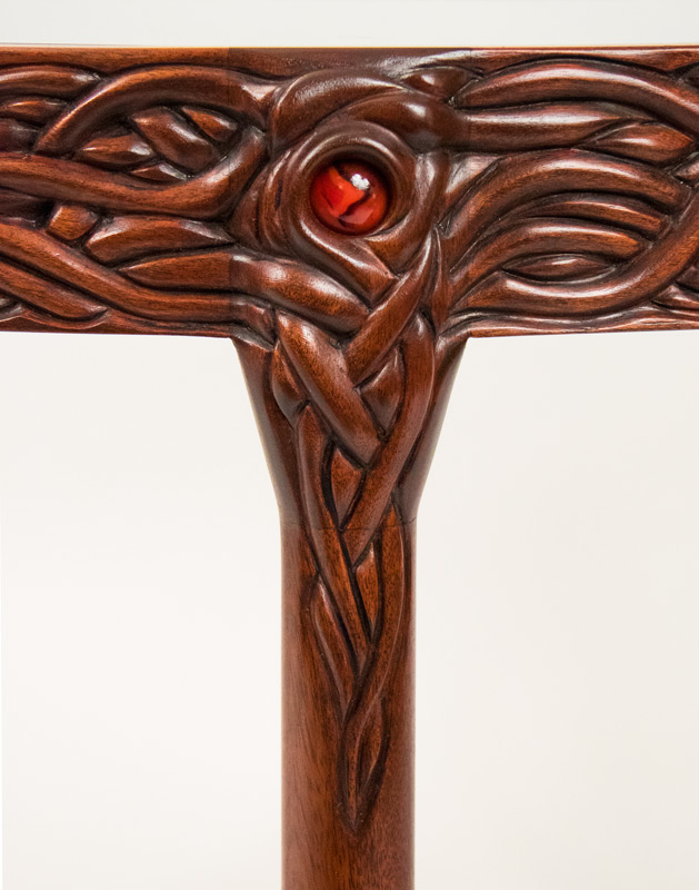 Detail of the leg top, showing the red marble.