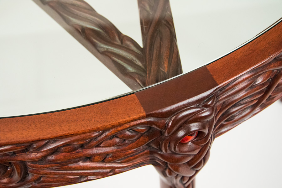 Detail of the leg top, showing a corner of the carved pentagram.