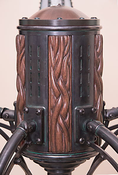 Lamp Hub made of machined brass and carved mahogany.