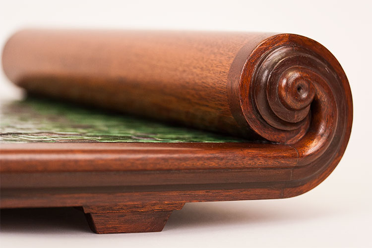 Scroll detail, showing the curve of the scroll and the foot detail.
