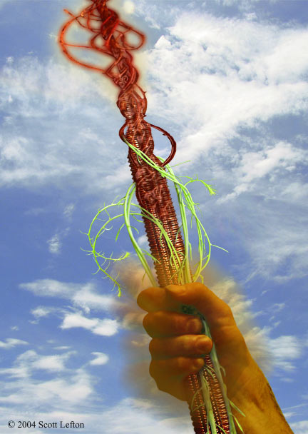 A hand surrounded by a slight glow holds aloft a metal staff and some green plant shoots.  The shoots are twining up the metal and merging with it to form something else, much more complex in form and material.
