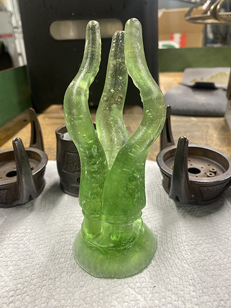 A raw glass casting of the end tendrils.
